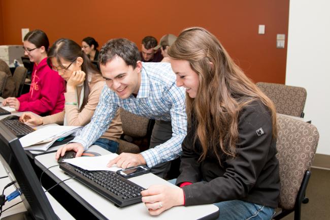Students look at a computer screen in mathematica class 