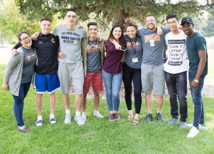 International students standing together in a group posing for a photo