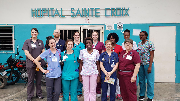 Image of group of nurses in Haiti including 4 CWC students and one faculty