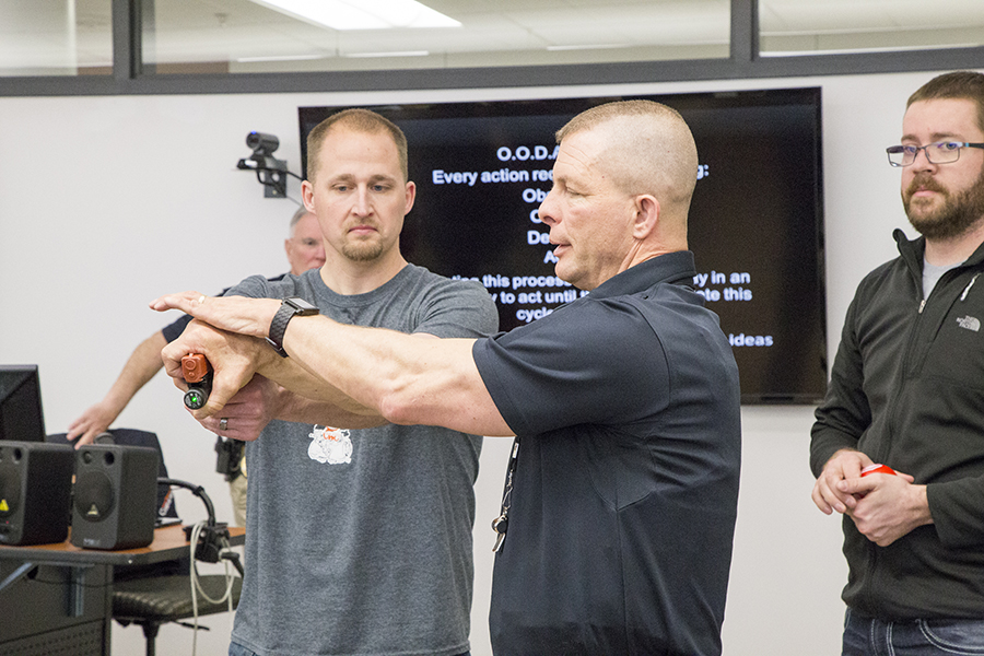 CWC employee learns how to carefully secure a gun from an active shooter