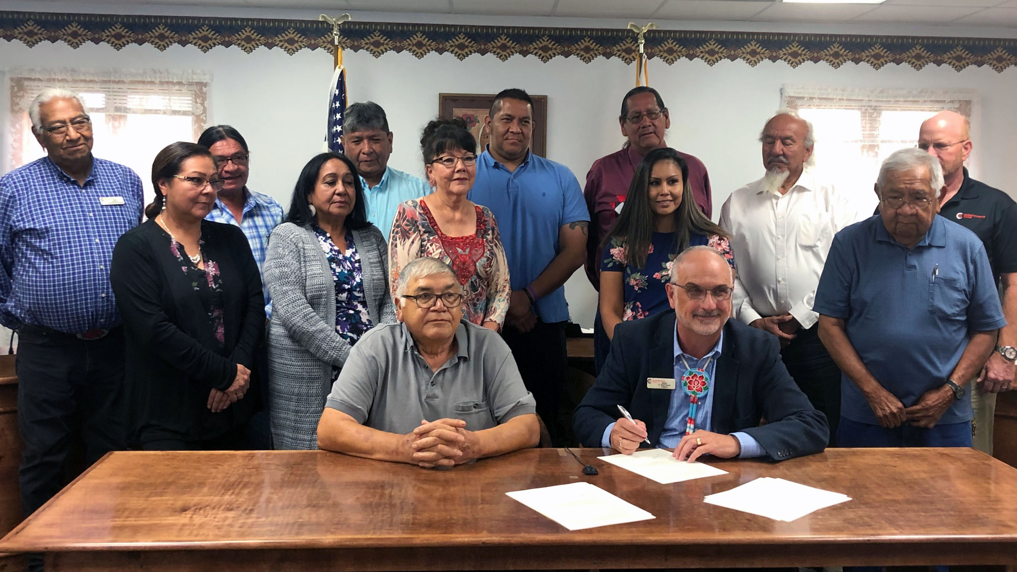 Eastern Shoshone Tribal Council members and Dr. Brad Tyndall signing MOU at tribal council chambers.