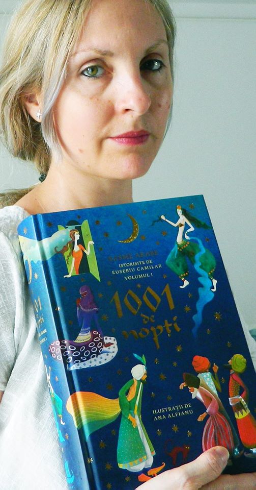 photo of CWC alumna Ana Alfianu holding her published book of illustrations