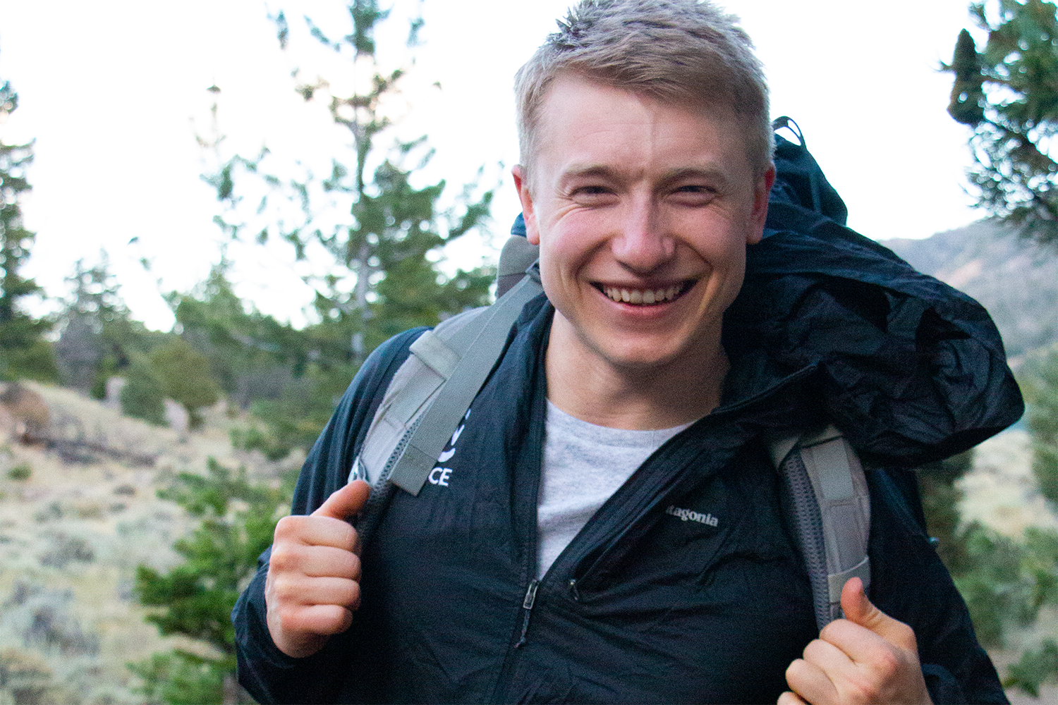 photos of CWC alumnus Marten Bauer wearing a backpack in the woods