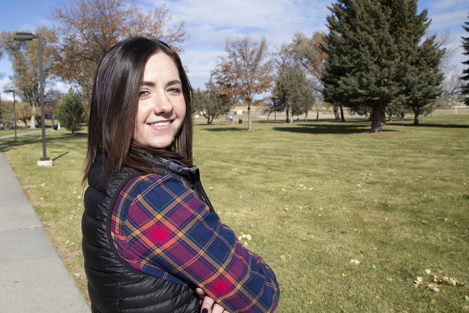 CWC student Abigail Arnold poses on the lawn of CWC
