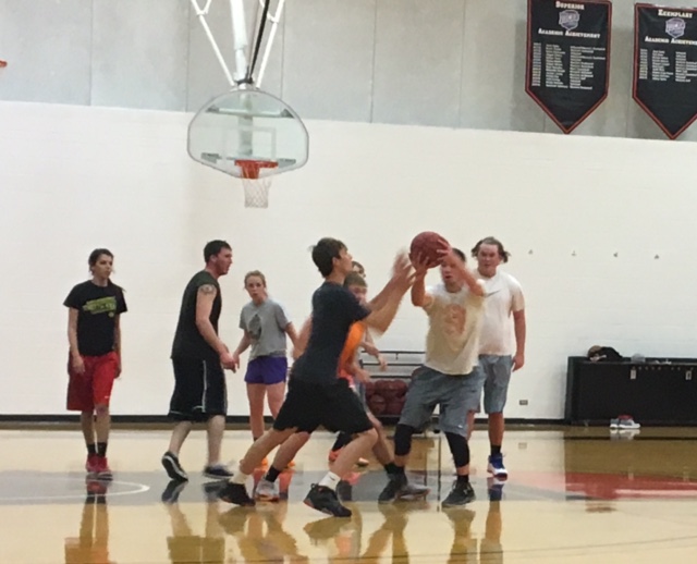 CWC student play basketball at intramural sports night at the CWC gym