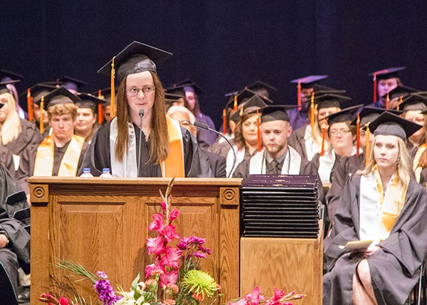 Student senate president gives speech on stage