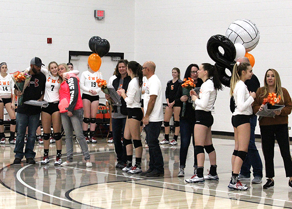 CWC sophomore volleyball players on the court with their loved ones.