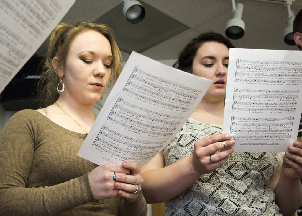 female students practice for choir