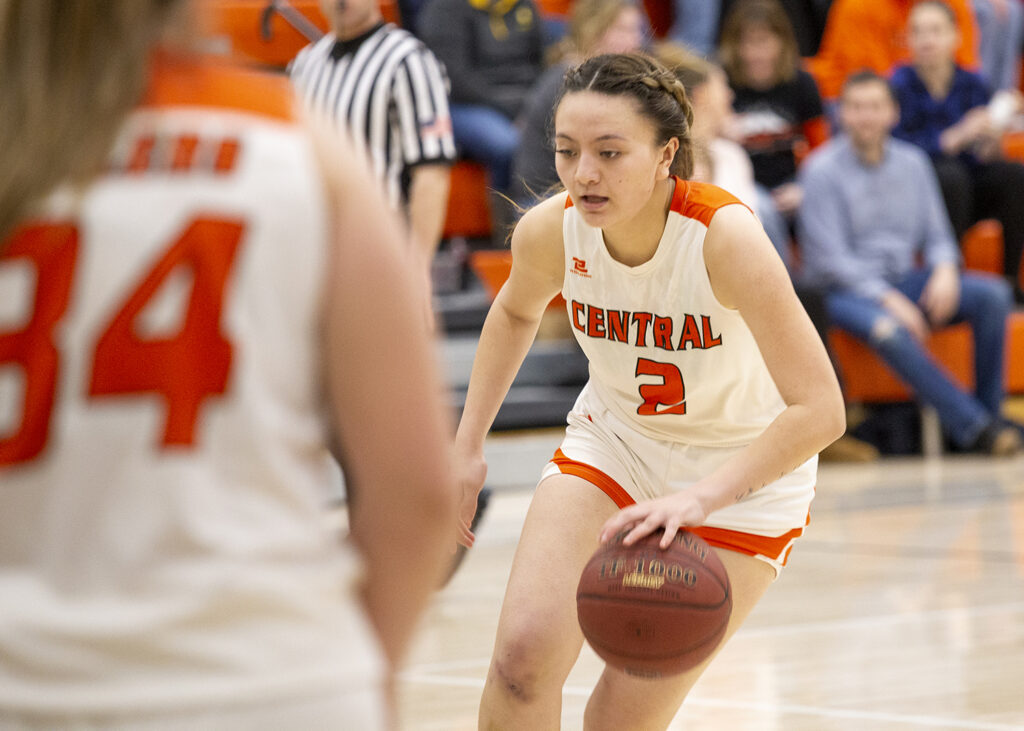 CWC women's basketball player dribbles the ball