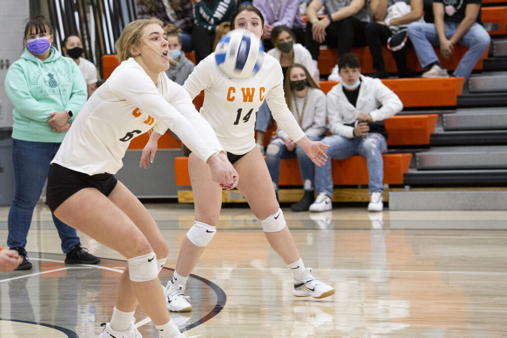 volleyball player bumps the ball