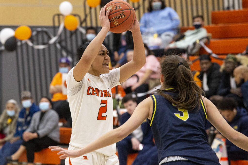 CWC women's basketball player gets ready to toss the ball