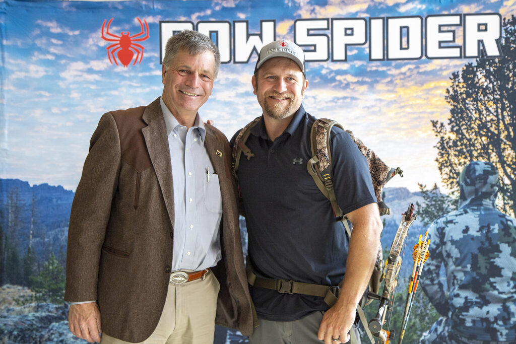 Governor Gordon stands with CWC graduate David Merrill for a photo