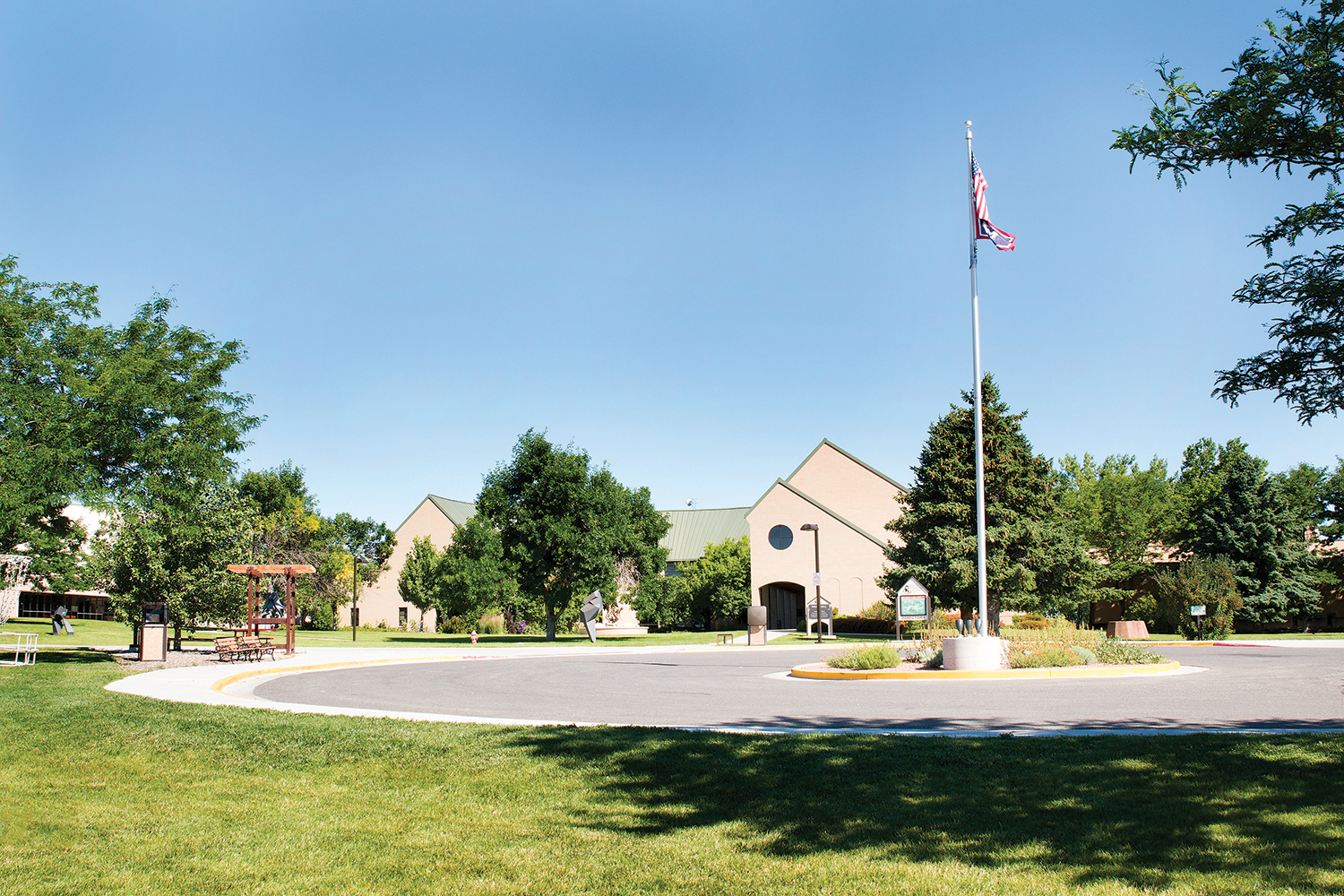 Main Building, flag pole, and trees at CWC