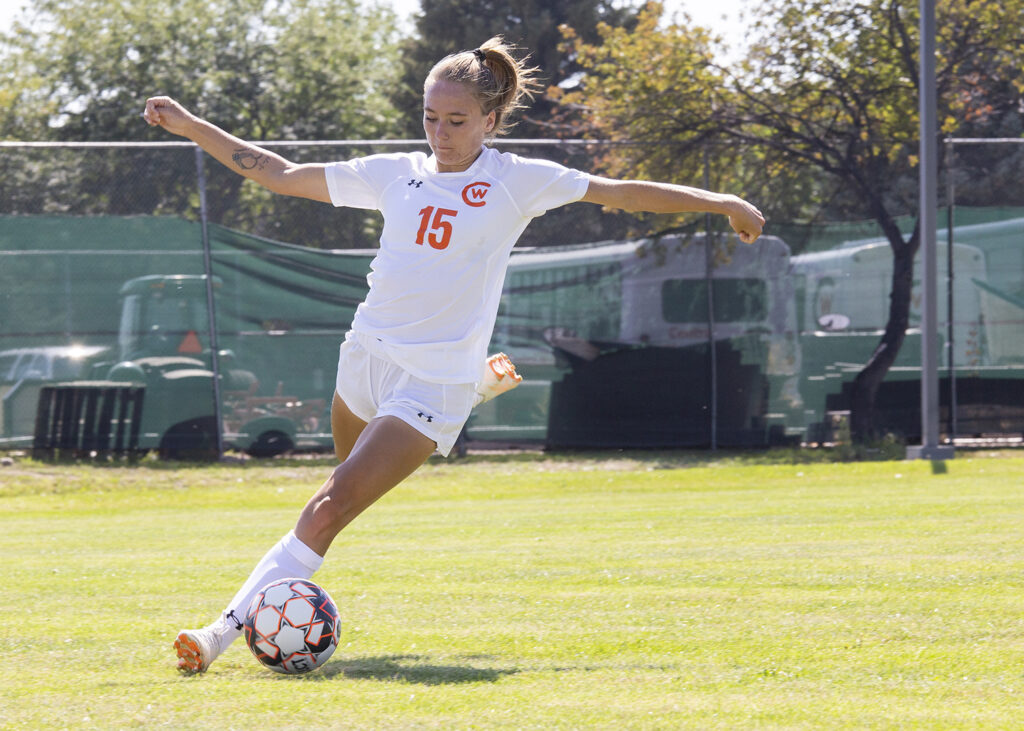 CWC rustler women's soccer player kicks the ball