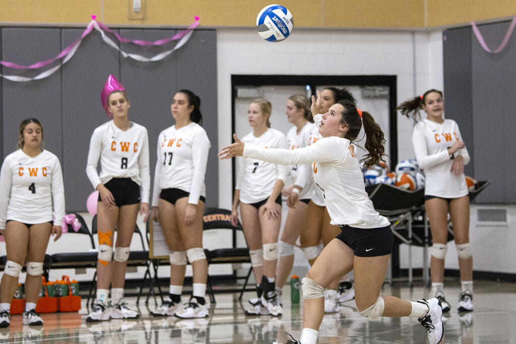 Rustler volleyball player bumps the volleyball