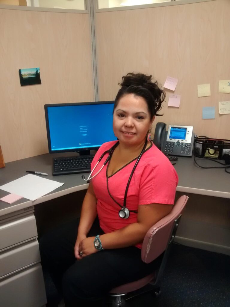 Keyona Natasha Smith sitting in a chair at the Arapaho Clinic