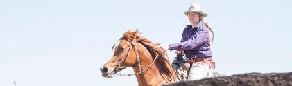 A girl riding a horse