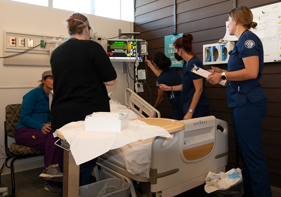 Students working in a lab to practice nursing