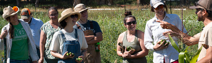 Farming students being instructed by a faculty member
