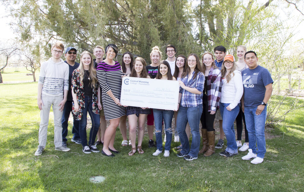 student ambassadors hold check