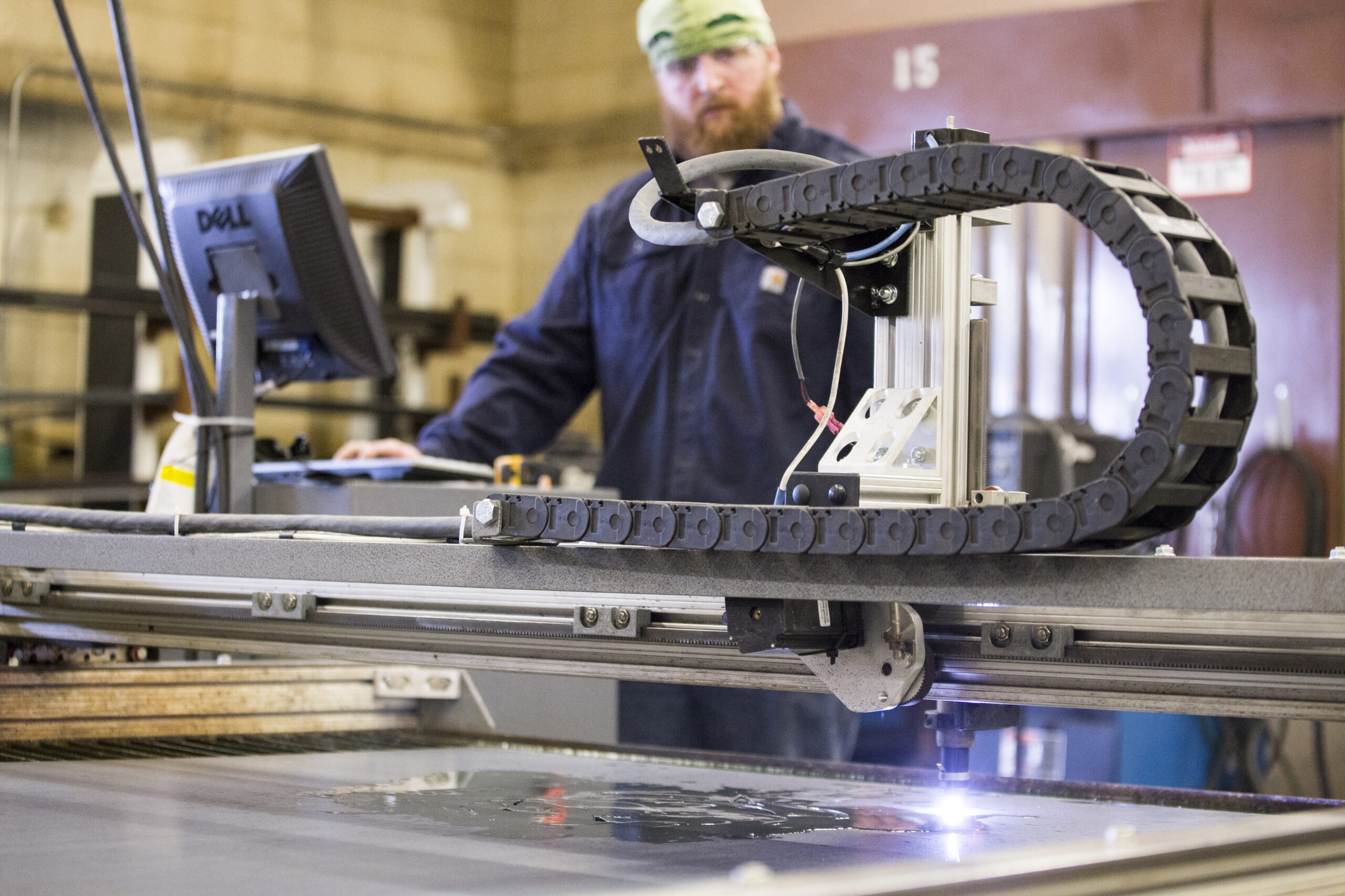 photo of Matt Dripps on a welding CNC machine