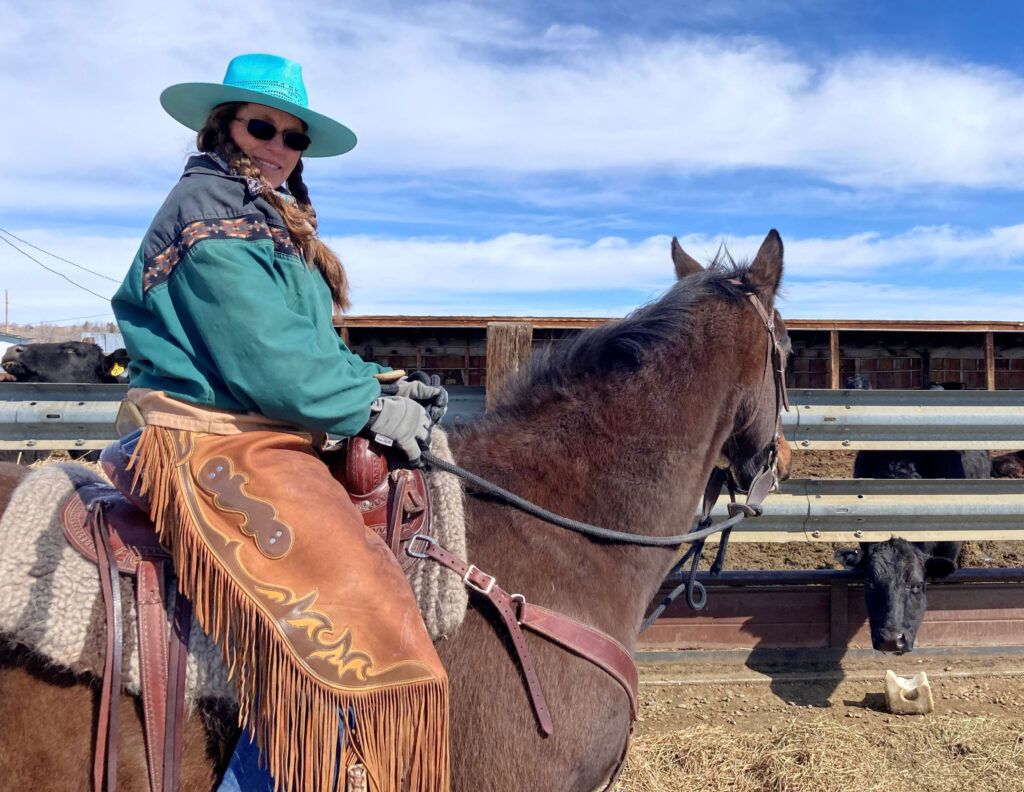 Photo of Debbie Kister on a horse